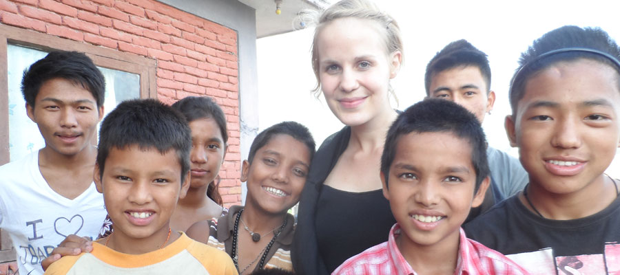 volunteer with kids in orphanage