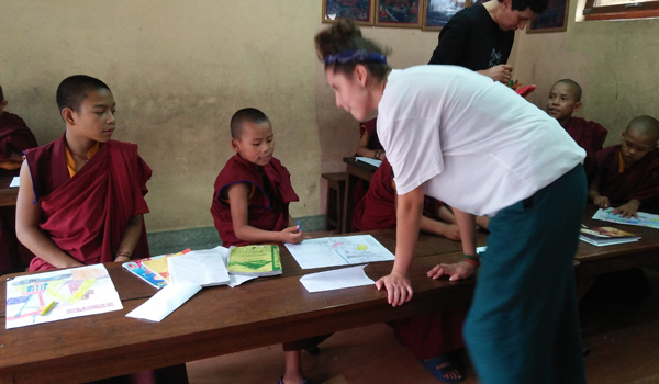 volunteer interacting with monks